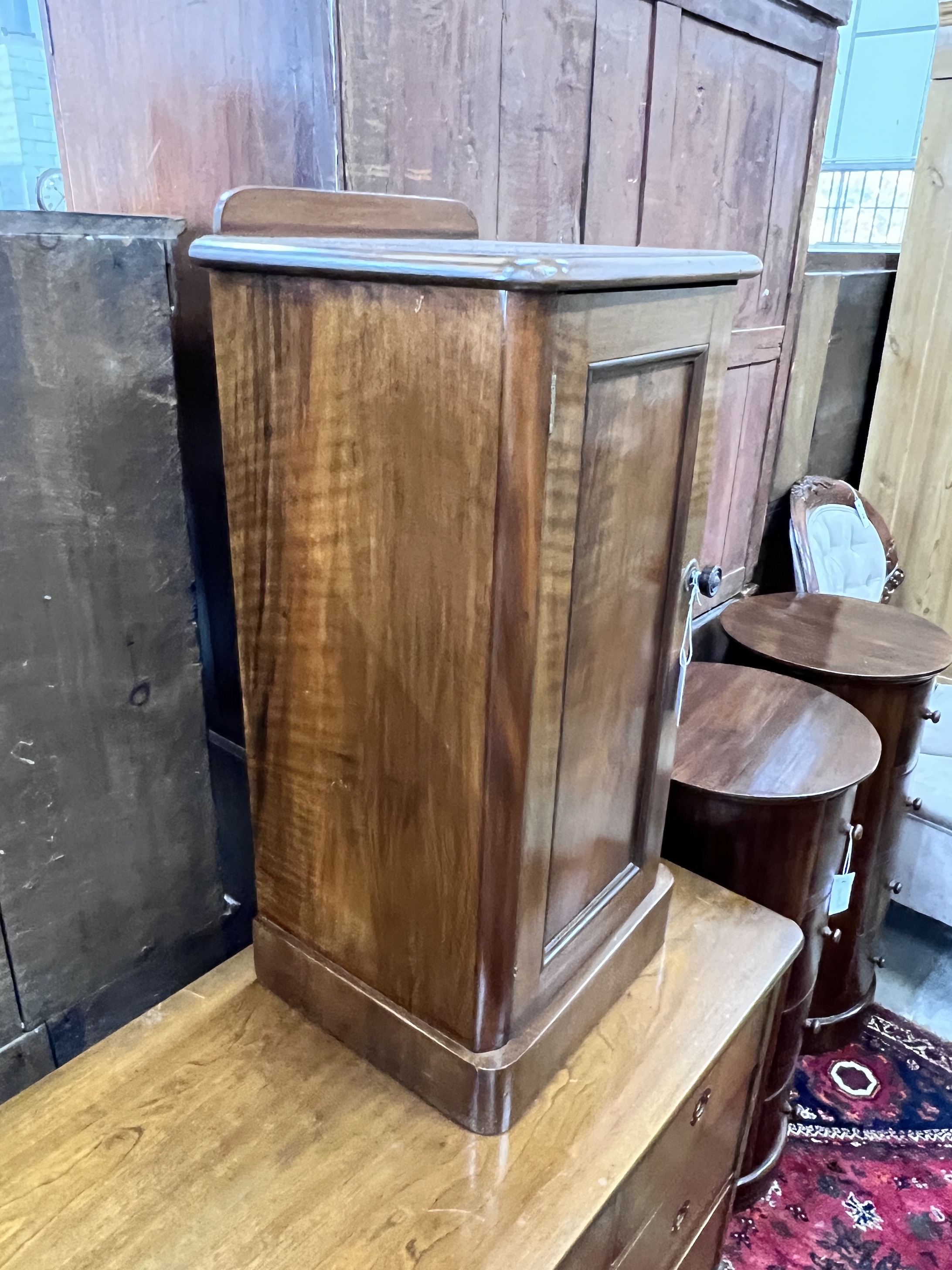 A pair of Victorian style mahogany bedside cupboards, width 39cm, depth 33cm, height 82cm